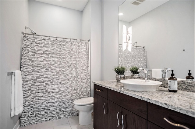 335 Bridge St NW Unit 500, Grand Rapids, MI 49504 - bathroom with vanity, toilet, curtained shower, and tile patterned flooring