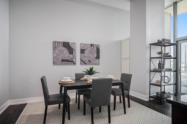335 Bridge St NW Unit 500, Grand Rapids, MI 49504 - dining space featuring healthy amount of natural light, wood finished floors, baseboards, and a high ceiling