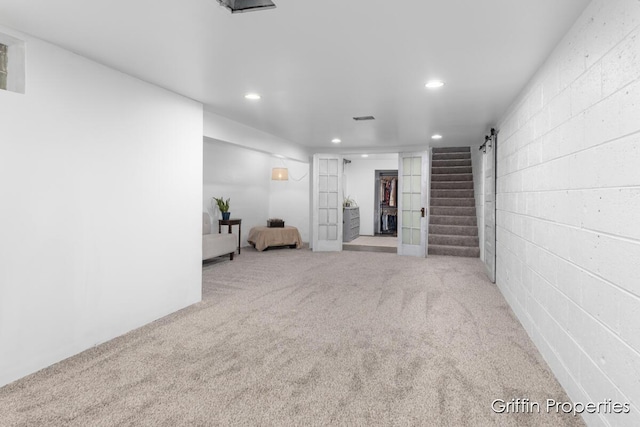 3020 Cascade Rd SE, Grand Rapids, MI 49506 - finished basement featuring recessed lighting, carpet flooring, stairway, and concrete block wall