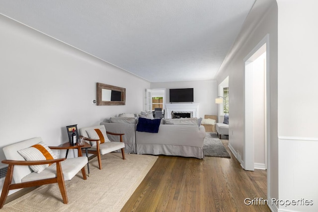 3020 Cascade Rd SE, Grand Rapids, MI 49506 - bedroom with dark wood-type flooring and a fireplace