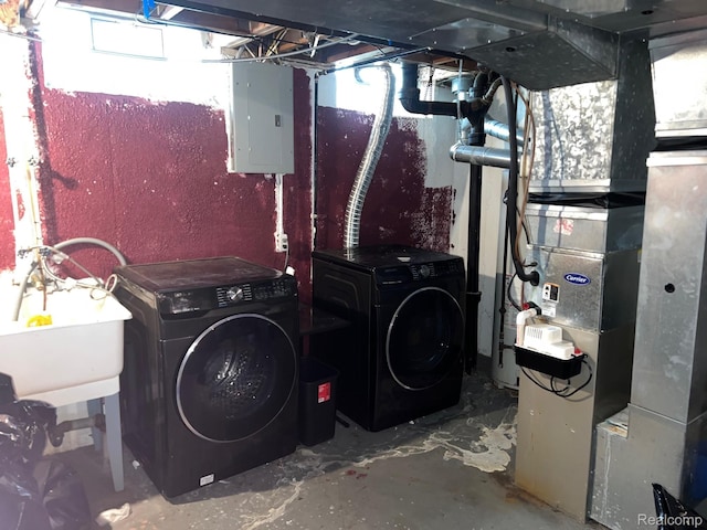 23538 Baker, Taylor, MI 48180 - unfinished basement with electric panel, washer and clothes dryer, and a sink
