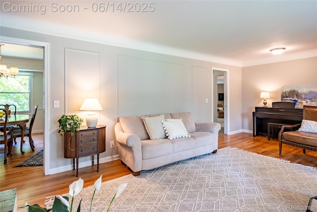 28441 Westerleigh Rd, Farmington, MI 48334 - living area featuring a chandelier and light wood-style flooring