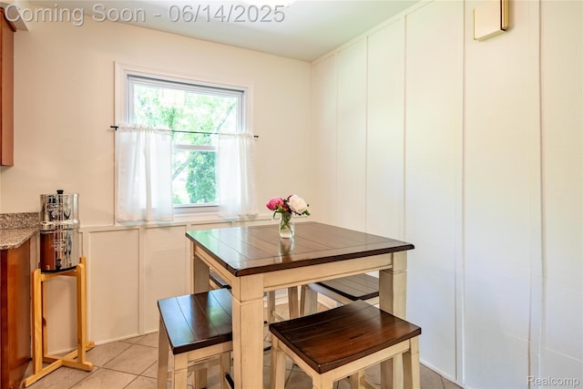 28441 Westerleigh Rd, Farmington, MI 48334 - dining space with light tile patterned floors and a decorative wall
