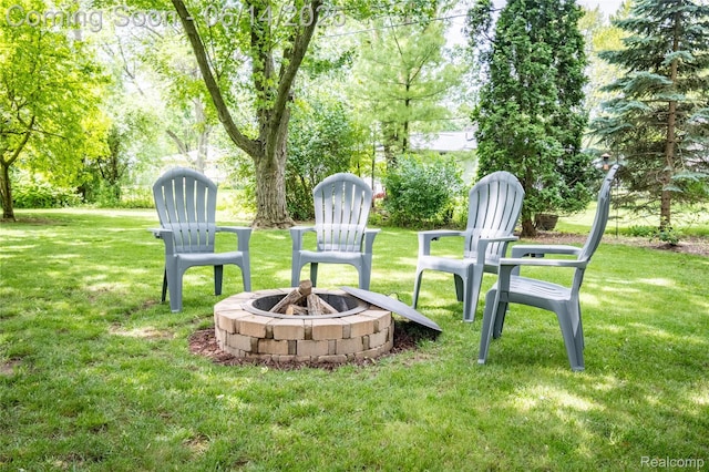 28441 Westerleigh Rd, Farmington, MI 48334 - view of grassy yard with a fire pit
