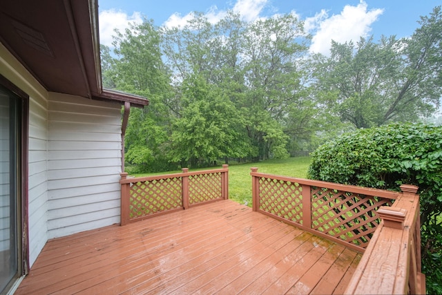 4109 Spring Arbor Rd, Jackson, MI 49201 - deck featuring a lawn and view of wooded area