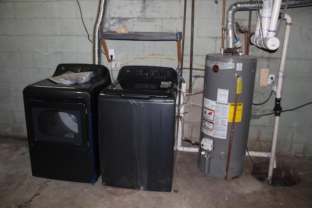 6994 E 34th Rd, Cadillac, MI 49601 - laundry area with gas water heater and washing machine and clothes dryer