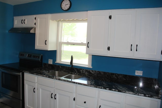 6994 E 34th Rd, Cadillac, MI 49601 - kitchen featuring electric stove, under cabinet range hood, a sink, white cabinetry, and dark stone countertops