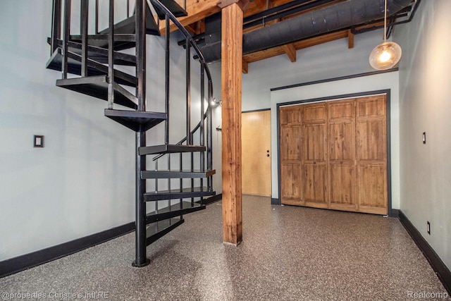 6533 E Jefferson Unit 427, Detroit, MI 48207 - below grade area with stairs and baseboards