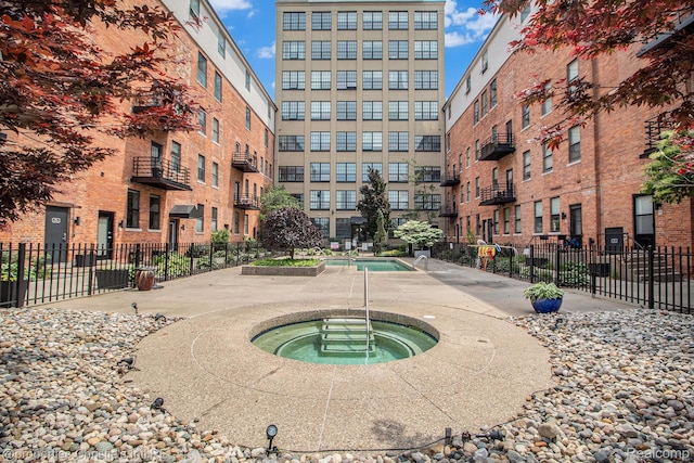 6533 E Jefferson Unit 427, Detroit, MI 48207 - view of pool featuring a hot tub