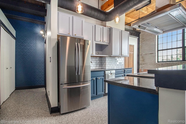 6533 E Jefferson Unit 427, Detroit, MI 48207 - kitchen featuring freestanding refrigerator, blue cabinets, backsplash, extractor fan, and light carpet
