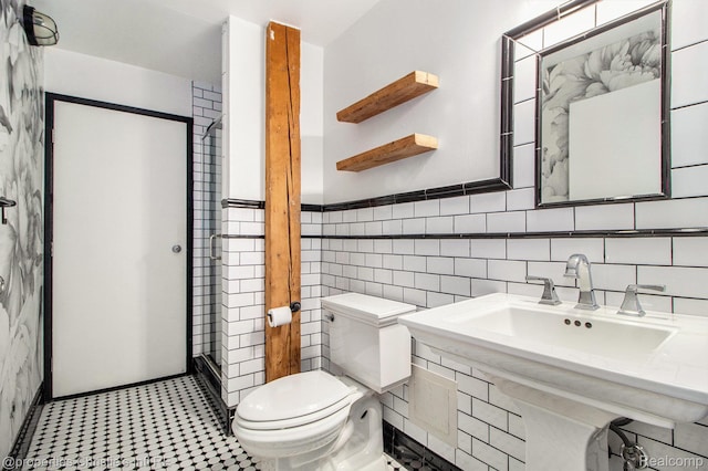 6533 E Jefferson Unit 427, Detroit, MI 48207 - bathroom featuring tile walls and wainscoting