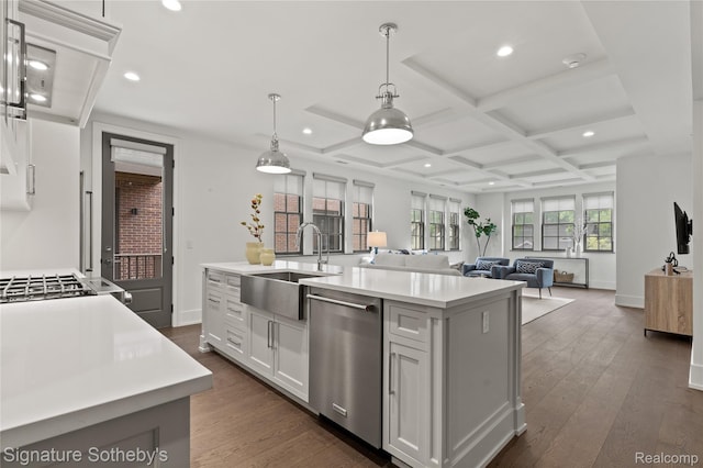 932 W 11 Mile Rd, Royal Oak, MI 48067 - kitchen with stainless steel dishwasher, a sink, light countertops, recessed lighting, and dark wood-style floors