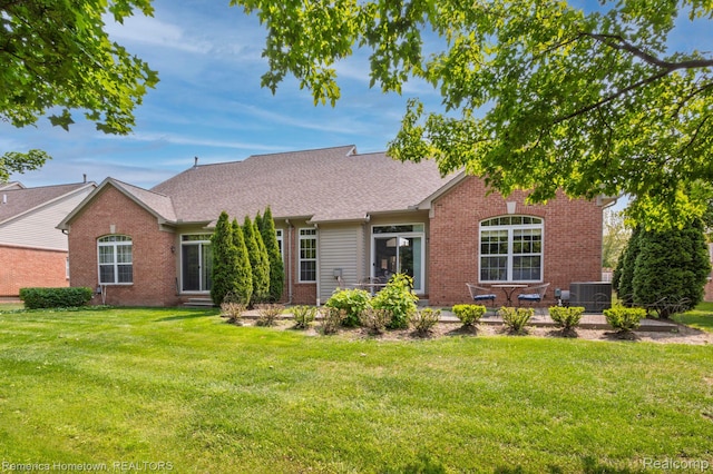 400 Cherry Grove Rd, Canton, MI 48188 - view of front of property with brick siding, a front yard, roof with shingles, and a patio