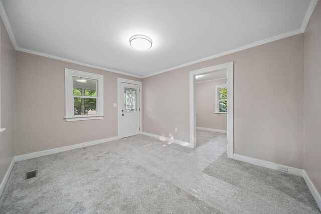 164 Cross St, Michigan Center, MI 49254 - unfurnished room featuring healthy amount of natural light, ornamental molding, baseboards, and light carpet