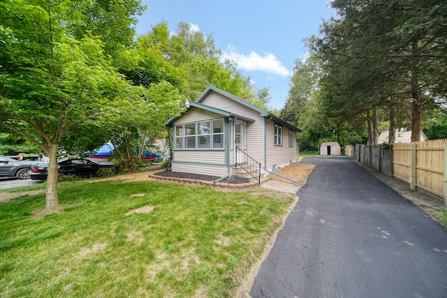 164 Cross St, Michigan Center, MI 49254 - bungalow-style house featuring driveway and a chimney