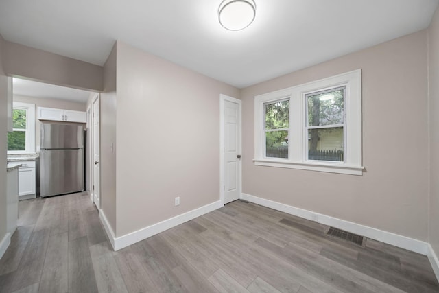 164 Cross St, Michigan Center, MI 49254 - unfurnished room featuring light wood-style flooring and baseboards