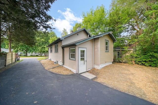 164 Cross St, Michigan Center, MI 49254 - view of side of home featuring a chimney