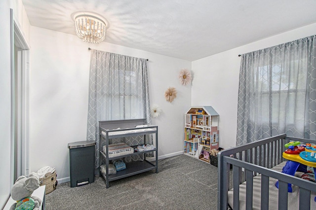 2030 Surry, Schoolcraft, MI 49087 - bedroom featuring a chandelier, carpet, baseboards, and a nursery area