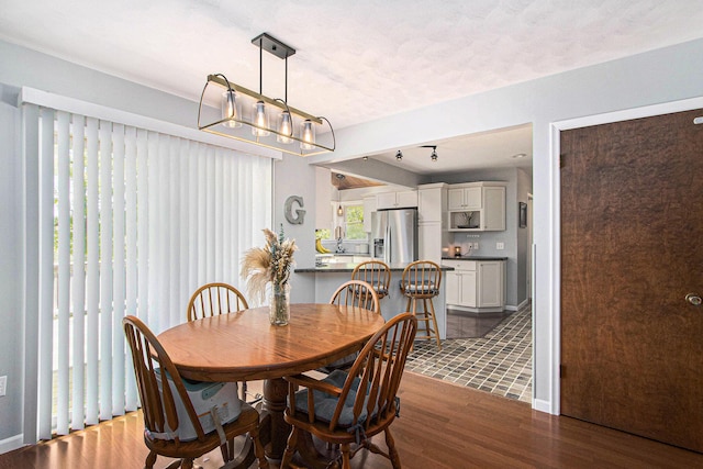 2030 Surry, Schoolcraft, MI 49087 - dining area with dark wood-style floors and baseboards