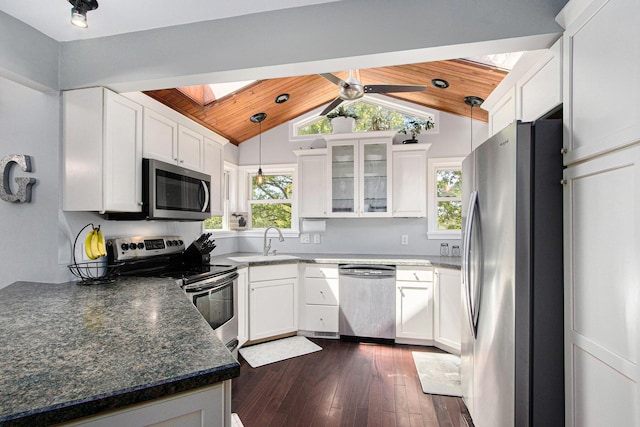 2030 Surry, Schoolcraft, MI 49087 - kitchen with stainless steel appliances, wooden ceiling, plenty of natural light, dark wood-style floors, and white cabinetry