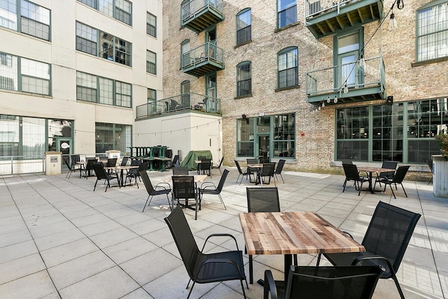 940 Monroe Ave NW Unit 335, Grand Rapids, MI 49503 - view of patio featuring outdoor dining area