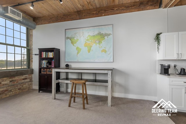 940 Monroe Ave NW Unit 335, Grand Rapids, MI 49503 - office space featuring wooden ceiling with exposed beams, light carpet, brick wall, and track lighting