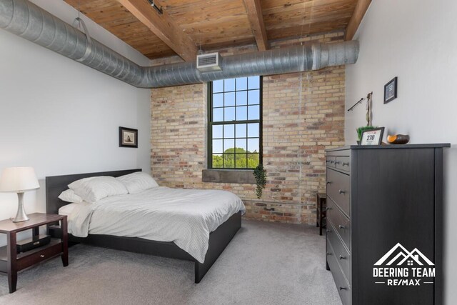 940 Monroe Ave NW Unit 335, Grand Rapids, MI 49503 - bedroom with brick wall, wood ceiling with exposed beams, and carpet flooring