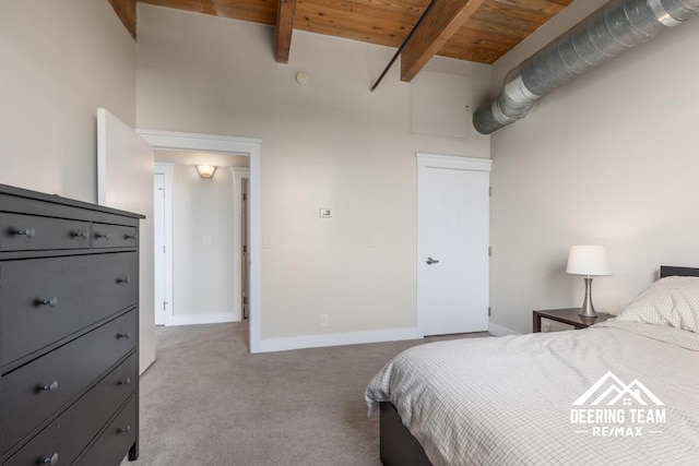 940 Monroe Ave NW Unit 335, Grand Rapids, MI 49503 - bedroom with carpet flooring, wood ceiling with exposed beams, and baseboards