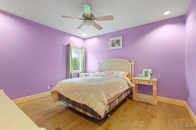 1269 Scott Ridge Dr, Adrian, MI 49221 - bedroom with light wood-style flooring, baseboards, a ceiling fan, and recessed lighting