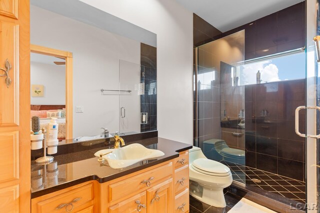 1269 Scott Ridge Dr, Adrian, MI 49221 - bathroom with toilet, vanity, and a shower stall