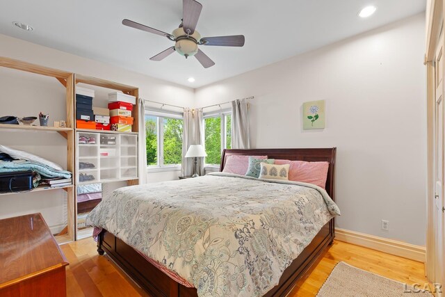 1269 Scott Ridge Dr, Adrian, MI 49221 - bedroom with light wood-style floors, baseboards, ceiling fan, and recessed lighting
