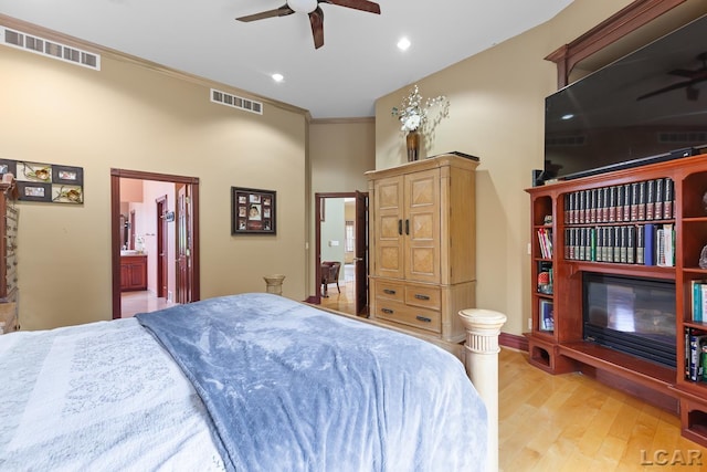 1269 Scott Ridge Dr, Adrian, MI 49221 - bedroom with light wood finished floors, ensuite bath, recessed lighting, ornamental molding, and a ceiling fan