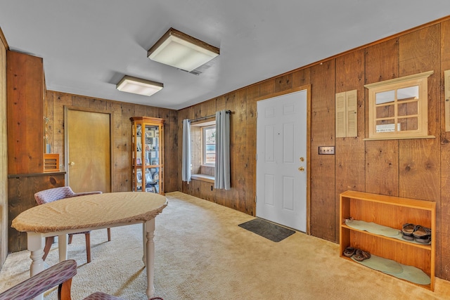 2006 W Rose Center Rd, Holly, MI 48442 - entrance foyer featuring carpet flooring and wooden walls