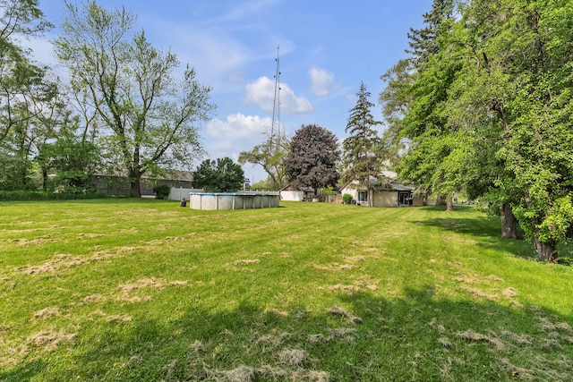 2006 W Rose Center Rd, Holly, MI 48442 - view of green lawn featuring an outdoor pool