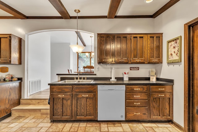 2006 W Rose Center Rd, Holly, MI 48442 - kitchen featuring white dishwasher, a sink, dark countertops, beamed ceiling, and arched walkways