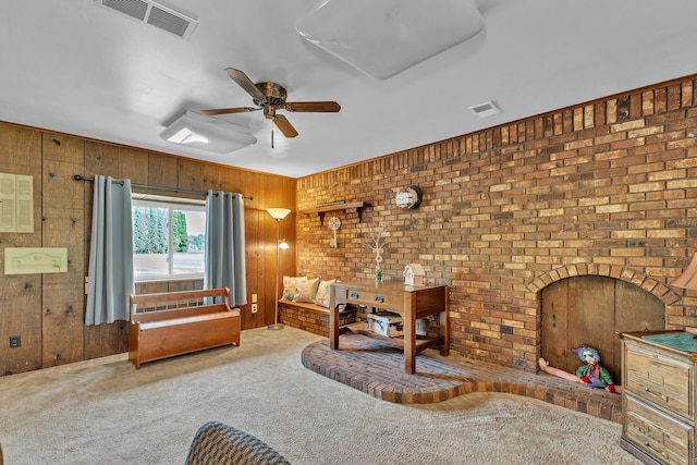 2006 W Rose Center Rd, Holly, MI 48442 - living area with carpet floors, wooden walls, and ceiling fan