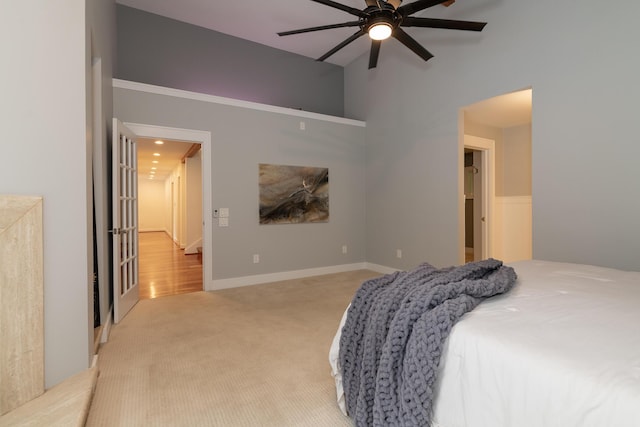 8562 W R Ave, Kalamazoo, MI 49009 - bedroom with light colored carpet and a ceiling fan