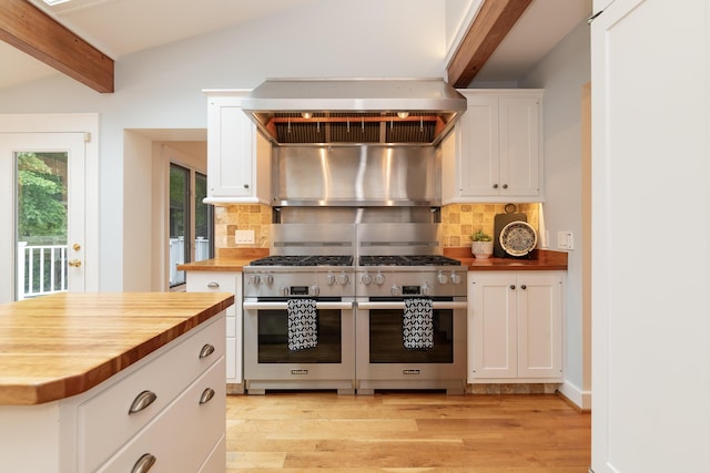 8562 W R Ave, Kalamazoo, MI 49009 - kitchen featuring butcher block counters, stainless steel range, range hood, and beamed ceiling
