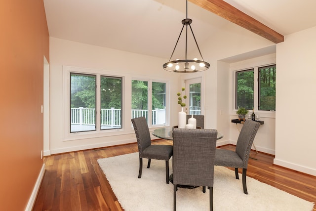 8562 W R Ave, Kalamazoo, MI 49009 - dining area featuring wood-type flooring, healthy amount of natural light, a chandelier, and baseboards