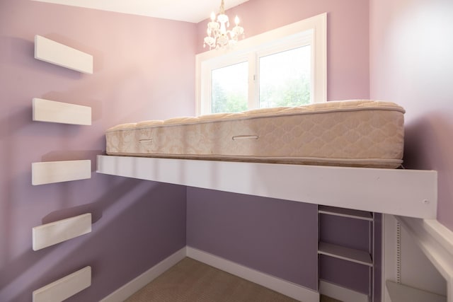 8562 W R Ave, Kalamazoo, MI 49009 - bathroom with baseboards and a chandelier