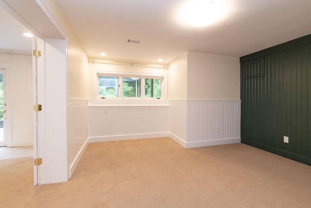 8562 W R Ave, Kalamazoo, MI 49009 - spare room featuring light colored carpet, a wainscoted wall, and recessed lighting