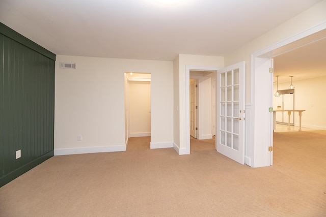 8562 W R Ave, Kalamazoo, MI 49009 - unfurnished bedroom with light carpet and baseboards