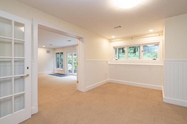 8562 W R Ave, Kalamazoo, MI 49009 - unfurnished room featuring light colored carpet, a wainscoted wall, and recessed lighting