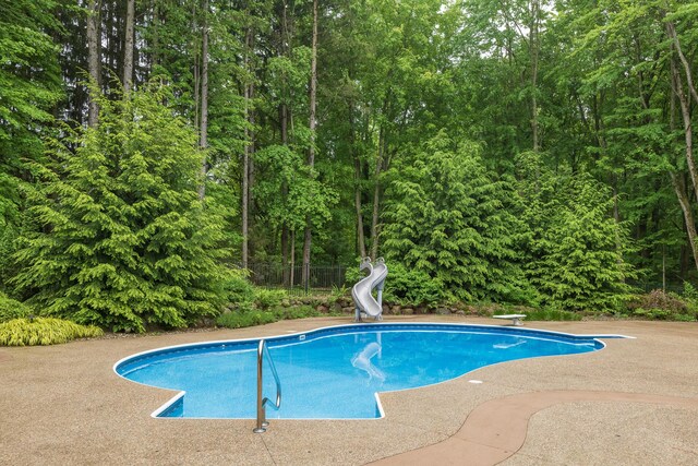 8562 W R Ave, Kalamazoo, MI 49009 - swimming pool with a water slide and a diving board