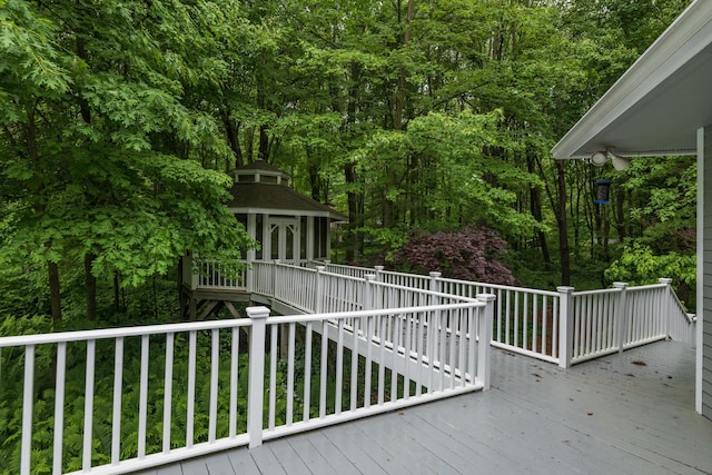 8562 W R Ave, Kalamazoo, MI 49009 - deck featuring an outdoor structure and a forest view