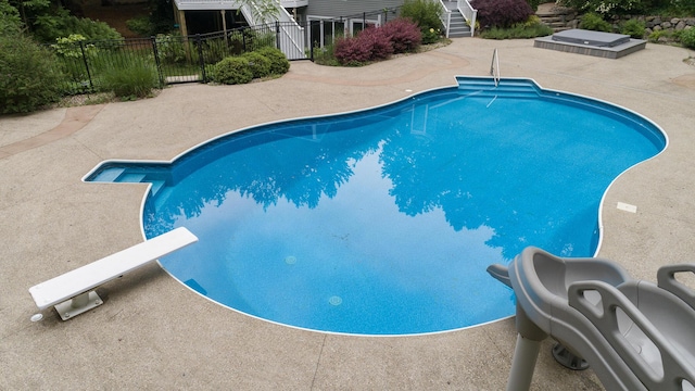 8562 W R Ave, Kalamazoo, MI 49009 - view of pool with a diving board, a patio, and stairway