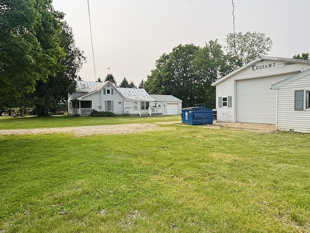 15522 Kimball Rd, Trufant, MI 49347 - view of green lawn featuring an outbuilding and driveway