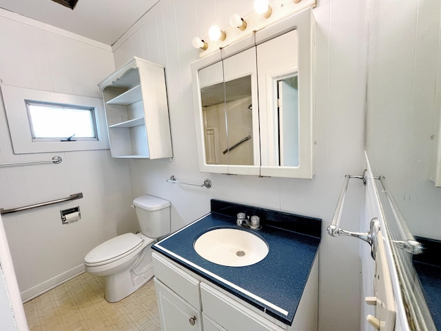 15522 Kimball Rd, Trufant, MI 49347 - bathroom with vanity, toilet, tile patterned floors, and baseboards