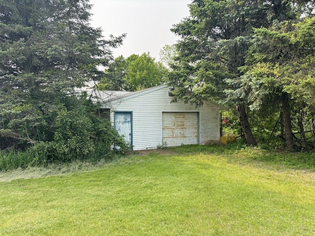 15522 Kimball Rd, Trufant, MI 49347 - view of grassy yard featuring an outbuilding and a garage