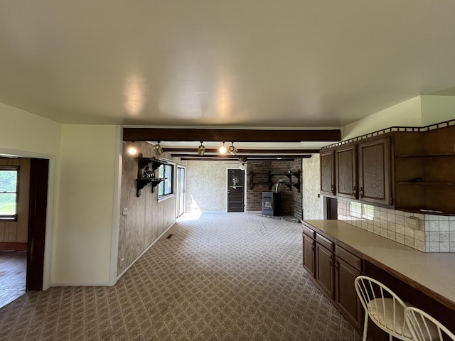 15522 Kimball Rd, Trufant, MI 49347 - hall with plenty of natural light, dark carpet, and baseboards